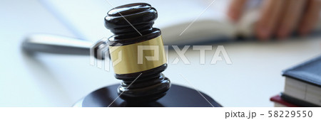 The judge hammer lies on table in The judge hammer lies on table in 58229550