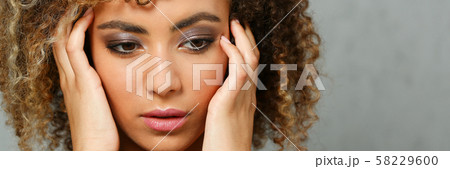 A beautiful black woman portrait. Tests the emotion A beautiful black woman portrait. Tests the emotion 58229600