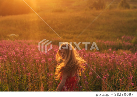Dancing and jumping girl in red dress among Dancing and jumping girl in red dress among 58230097