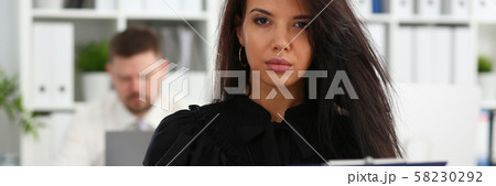 Beautiful smiling brunette woman hold in arms pink pen 58230292