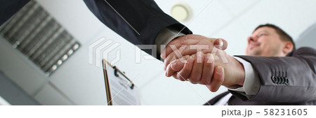 Man in suit shake hand as hello in office 58231605