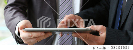 Two businessman are looking and 58231635