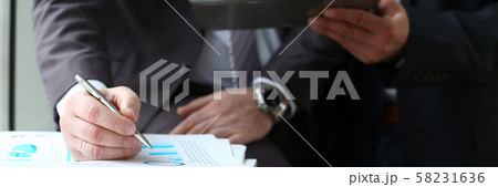 Two businessman are looking and 58231636