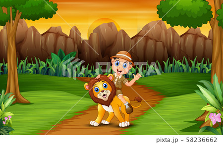 Happy zookeeper man with a lion in the jungle 58236662