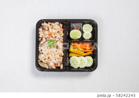 Fried rice with fried tuna put in black plastic box Fried rice with fried tuna put in black plastic box 58242243