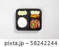 Fried Pork with Garlic and Pepper and rice put in black plastic box 58242244