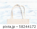 Zero waste. Organic fabric bag on white wooden background 58244172