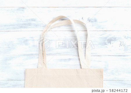 Zero waste. Organic fabric bag on white wooden background 58244172