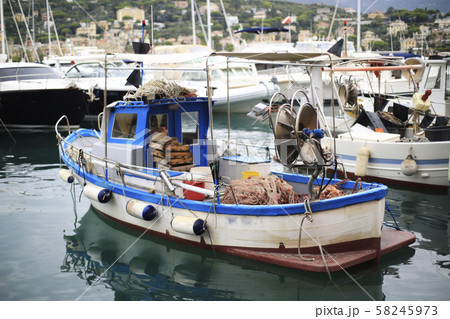 Old fishing boat with tackle in Italy 58245973