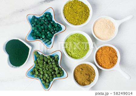 Superfood smoothie boosters, various dietary supplements in bowls 58249014