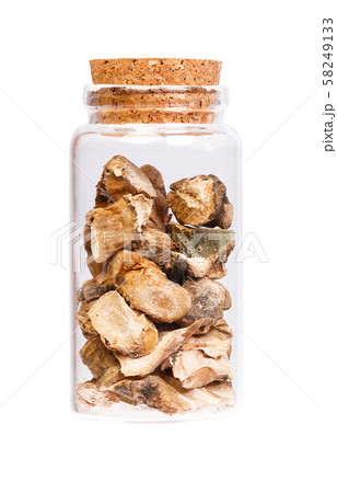 Acorus calamus in a bottle with cork stopper for medical use isolated. Acorus calamus in a bottle with cork stopper for medical use isolated. 58249133