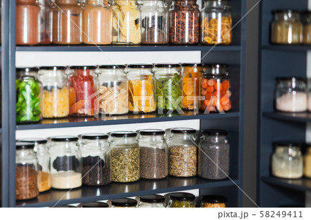 Shelf in a shop with colorful natural herbs and spices Shelf in a shop with colorful natural herbs and spices 58249411