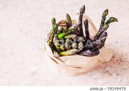 Bunch of fresh purple asparagus spears in the bag Bunch of fresh purple asparagus spears in the bag 58249479
