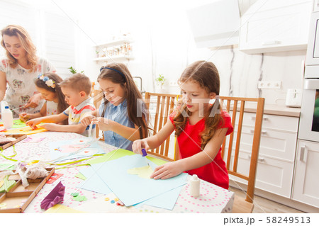 Girls and boys make postcards in a group 58249513