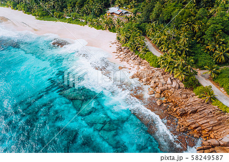 Aerial view of tropical dreamy beach Anse Bazarca, Mahe island, Seychelles. White powdery sand Aerial view of tropical dreamy beach Anse Bazarca, Mahe island, Seychelles. White powdery sand 58249587