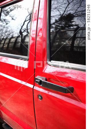 Close-up image of a red old car. Close-up image of a red old car. 58251246
