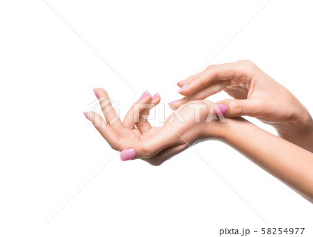 Female hands close up. Applying cream. 58254977