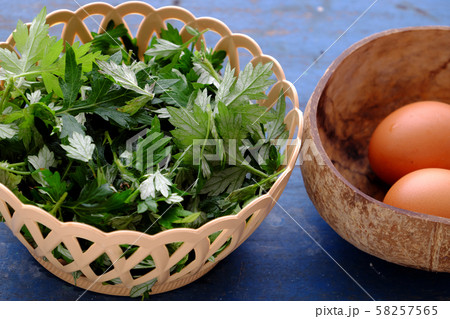 Raw materials fried egg with mugwort leaves 58257565