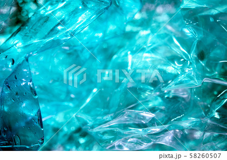 Holographic background in the style of the 80-90s. Real texture of cellophane film in bright acid Holographic background in the style of the 80-90s. Real texture of cellophane film in bright acid 58260507