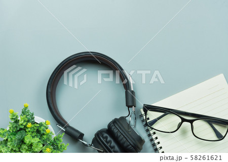 notebook glasses and earphones on gray background notebook glasses and earphones on gray background 58261621