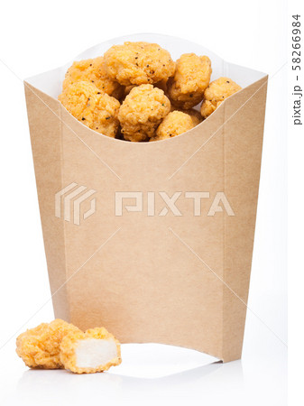 Crunchy chicken popcorn bites in paper container Crunchy chicken popcorn bites in paper container 58266984