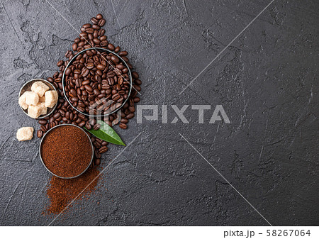 Fresh raw organic coffee beans with ground powder Fresh raw organic coffee beans with ground powder 58267064