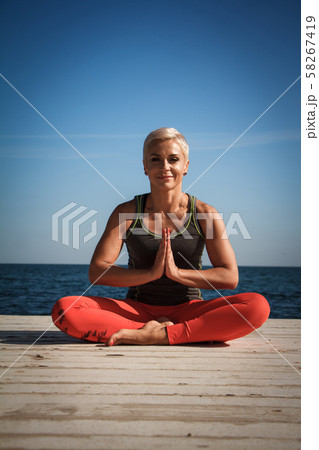 Close-up portrait of adult blond woman with short 58267419