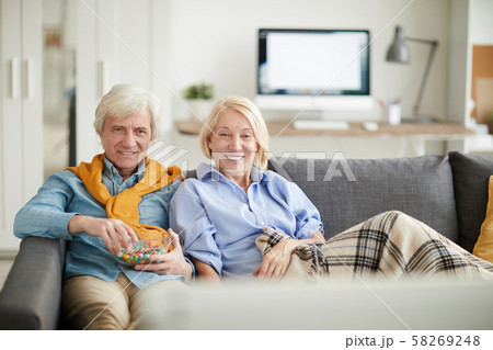 Modern Senior Couple Watching TV 58269248