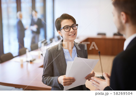 Smiling Young Businesswoman in Conference Room 58269504