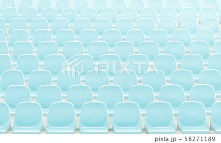 Light  blue rows of seats on the stadium . 58271189