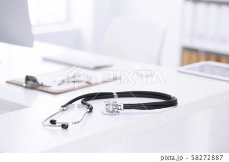Stethoscope, prescription medical form lying on a table with pc computer. Medicine or pharmacy Stethoscope, prescription medical form lying on a table with pc computer. Medicine or pharmacy 58272887
