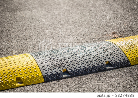 Road bumps to reduce speed - close-up 58274838