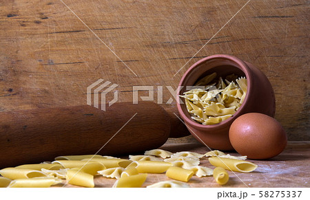 Baking ingedients. pasta on table 58275337