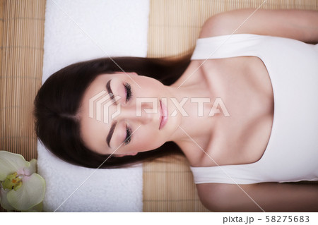 Spa. Women's health. Portrait of a beautiful smiling woman with a fresh face. Soft skin. A healthy 58275683