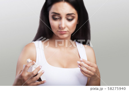 A pack of cigarettes. A young girl holds a full pack of cigarettes. Against smoking Smoking is A pack of cigarettes. A young girl holds a full pack of cigarettes. Against smoking Smoking is 58275940