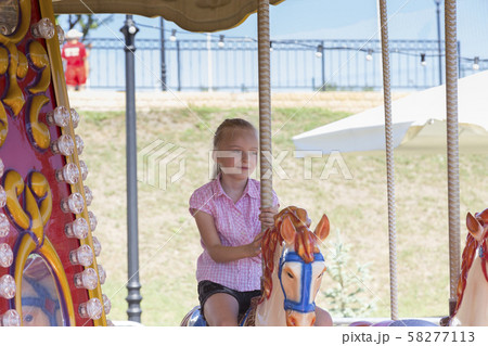 Cute beautiful little girl on a playground. Cute beautiful little girl on a playground. 58277113