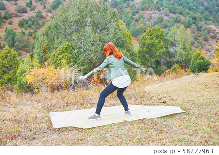 Female hiker walking in mountains forest. Female hiker walking in mountains forest. 58277963