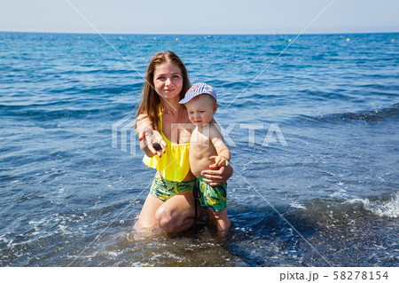 Mother and son swim in the sea Mother and son swim in the sea 58278154
