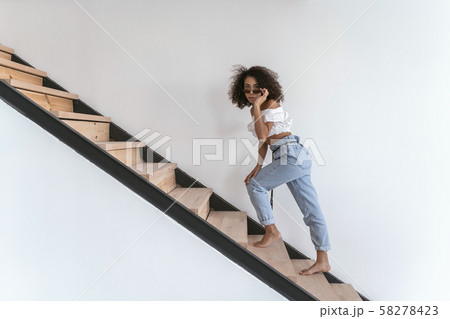 Woman looking closely at her friend standing afar 58278423