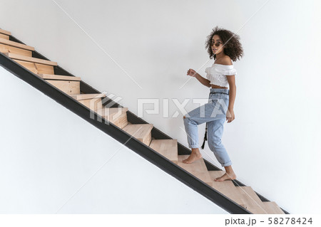 Pretty woman coming home after her stroll Pretty woman coming home after her stroll 58278424