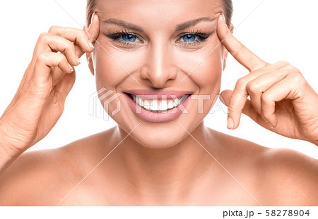 Happy woman enjoying in her healthy skin. Woman touching her face. 58278904