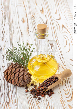 cedar oil in glass bottle 58279549