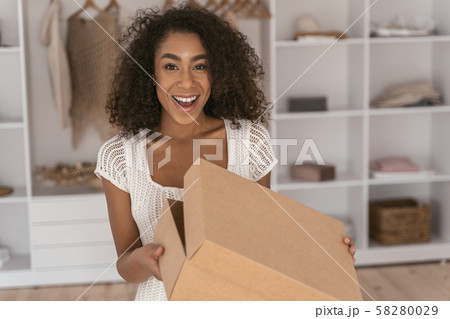 Positive delighted female person looking at camera 58280029