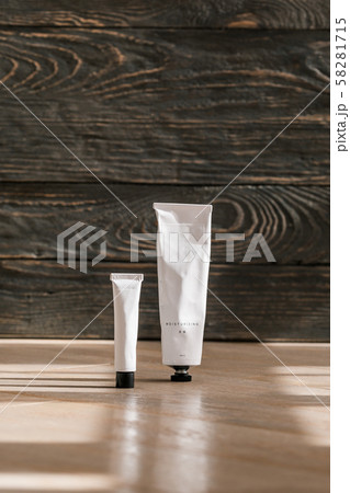 Cosmetic white tube on wooden table 58281715