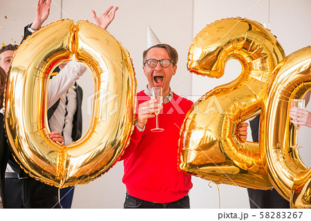 Business people celebrating New Year Business people celebrating New Year 58283267