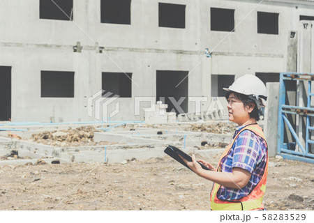 Woman construction engineer at construction site Woman construction engineer at construction site 58283529