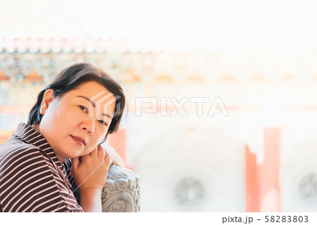Woman at Wat Boromracha Kanchanapisek Anusorn Woman at Wat Boromracha Kanchanapisek Anusorn 58283803