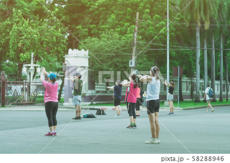 Group of elderly friend doing aerobic dance after work   together at Lumpini Park in Bangkok, Thailand. 58288946