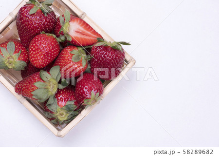 Red strawberry closeup on white background 58289682