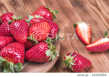Ripe fresh strawberries in Minsk on a wooden table 58289809